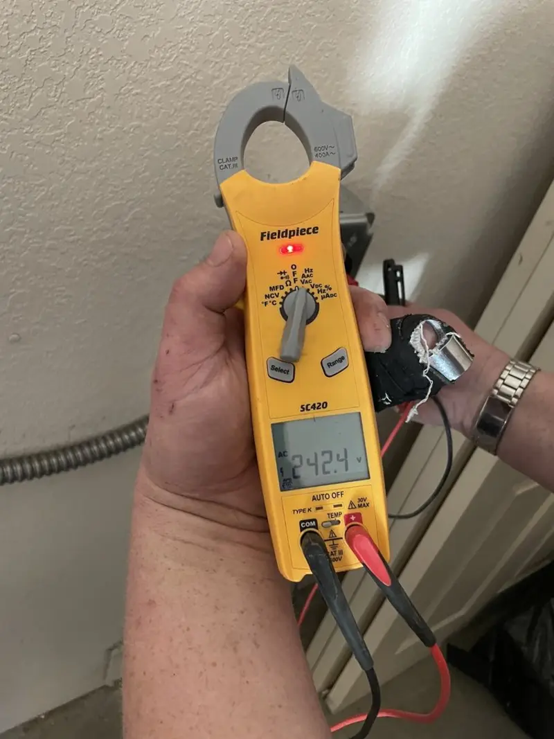 Voltage testing with clamp meter during Whole House Surge Protector in Dewey